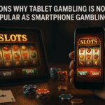 Tablet and smartphone displaying slot games side by side with casino chips and cards