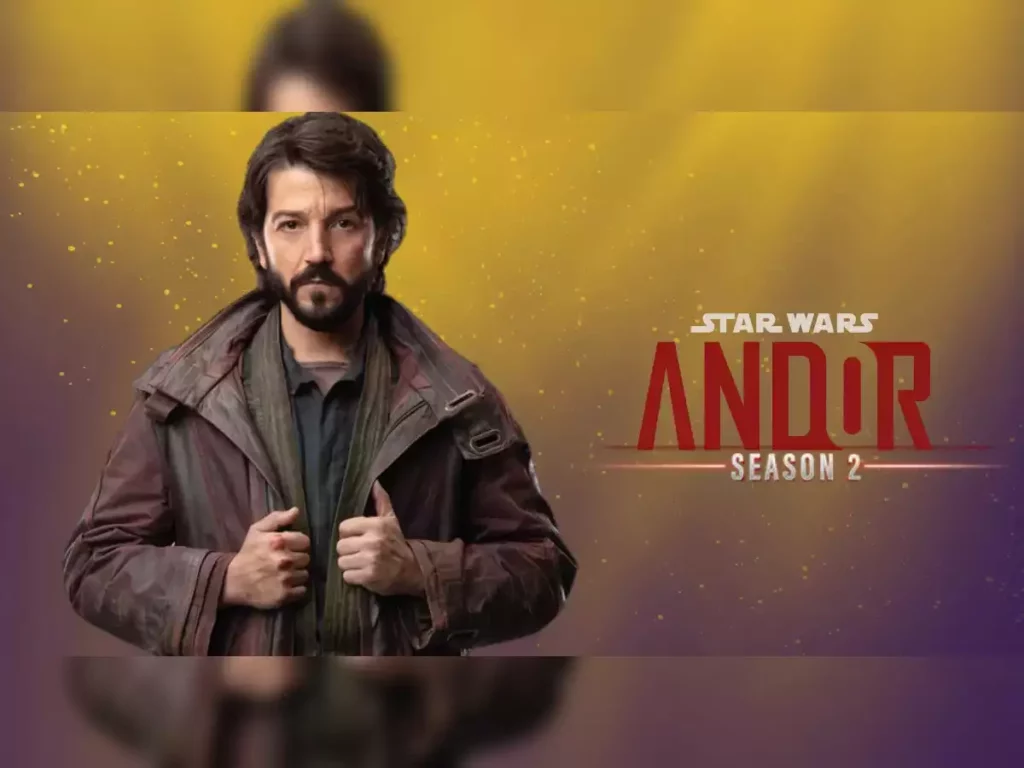 Poster for Star Wars: Andor Season 2 featuring Diego Luna as Cassian Andor. He is dressed in rugged clothing with a serious expression, set against a gradient background of yellow and purple with the series title and season number prominently displayed.