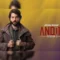 Poster for Star Wars: Andor Season 2 featuring Diego Luna as Cassian Andor. He is dressed in rugged clothing with a serious expression, set against a gradient background of yellow and purple with the series title and season number prominently displayed.