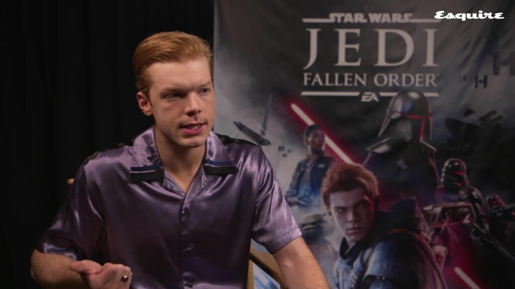 Cameron Monaghan in an interview setting, reacting with surprise and excitement as he recalls the moment he found out he was auditioning for a Star Wars game.