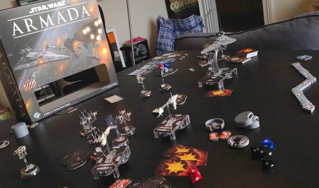Star Wars Armada board game setup on table.