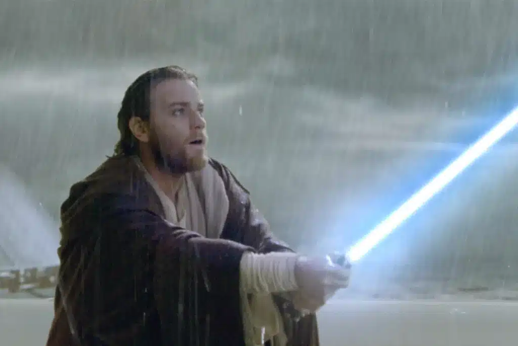 Jedi with lightsaber battling in heavy rain.