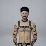 inZOI male character wearing BDSM leather harness outfit