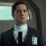 Syril Karn dressed in Imperial attire during a tense moment in Andor. His belief in law and order drives his actions, despite his naive trust in the Empire's ideals of justice.
