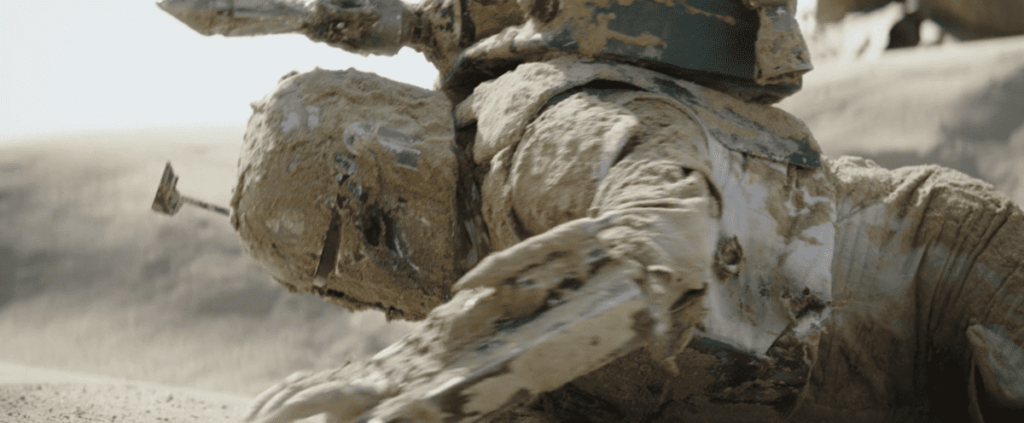 Boba Fett covered in sand after crawling out of the Sarlacc Pit