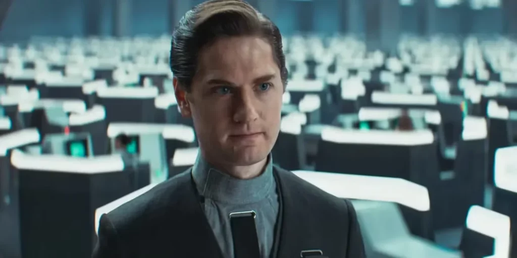Syril Karn amidst the sterile environment of the Imperial Bureau. His journey through Andor highlights the dangers of blind loyalty and misplaced trust in authoritarian regimes.