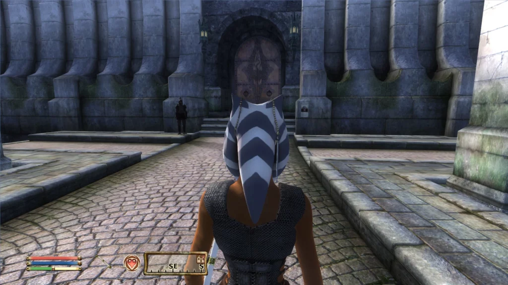 Rear view of Ahsoka Tano in Oblivion Remastered, displaying the intricate design of her Togruta headpiece and armor as she walks through the Imperial City. The attention to detail brings the Star Wars character to life within the Elder Scrolls universe.