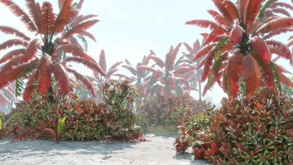 Dense jungle path surrounded by red and green plants