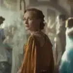 Mon Mothma at a lavish party scene from Andor series in a gold gown