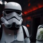 Two stormtroopers inside a dark corridor with red emergency lighting