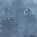 Nude warrior overlooking misty mountain temples in Wuchang: Fallen Feathers mod
