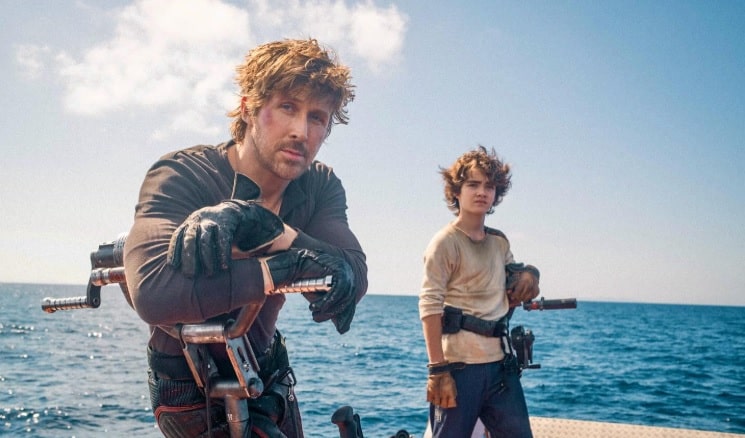 Ryan Gosling and Flynn Gray aboard a water vessel on location in Sardinia filming Star Wars: Starfighter