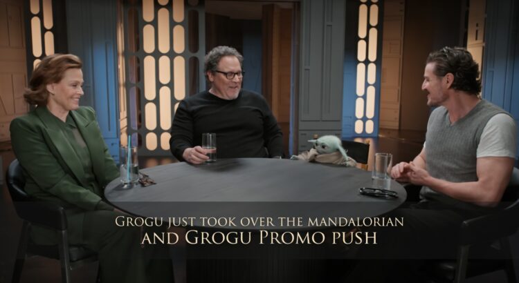 Editorial header image showing Grogu seated with Jon Favreau, Pedro Pascal, and Sigourney Weaver during a Mandalorian and Grogu promo roundtable