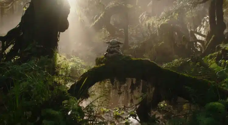 Small green alien on mossy forest log
