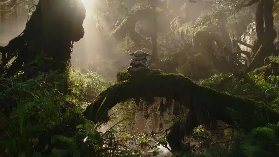 Small green alien on mossy forest log